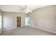 Spacious bedroom with access to bathroom and carpet floors at 42 Marker Rd, Rotonda West, FL 33947