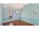 Bright dining room with hardwood floors and view at 42 Marker Rd, Rotonda West, FL 33947