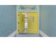 Bright yellow double door entryway to the home at 42 Marker Rd, Rotonda West, FL 33947