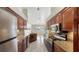 Kitchen with granite counters and wood cabinets at 42 Marker Rd, Rotonda West, FL 33947