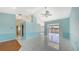 Open living room with tile floors and access to the pool area at 42 Marker Rd, Rotonda West, FL 33947