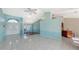 Spacious living room with tile flooring, high ceilings, and a view of the kitchen at 42 Marker Rd, Rotonda West, FL 33947