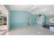 Bright and airy living area with tile floors and views to other rooms at 42 Marker Rd, Rotonda West, FL 33947