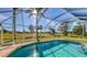 Screened-in rectangular pool with a view of the golf course at 42 Marker Rd, Rotonda West, FL 33947