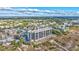Elevated perspective of the beachfront condo, showcasing the tennis court and surrounding area at 420 Beach Rd # 203, Sarasota, FL 34242