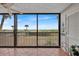Spacious balcony with ocean views and sliding glass doors at 420 Beach Rd # 203, Sarasota, FL 34242