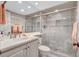 Bathroom with walk-in shower, white vanity, and tile flooring at 420 Beach Rd # 203, Sarasota, FL 34242