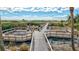 Scenic walkway leading to the beach with seating areas at 420 Beach Rd # 203, Sarasota, FL 34242
