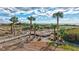 Elevated boardwalk leading to the beach with seating areas at 420 Beach Rd # 203, Sarasota, FL 34242