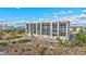 Coastal condo building nestled among lush landscaping at 420 Beach Rd # 203, Sarasota, FL 34242
