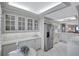 Kitchen with ample counter space and white cabinetry at 420 Beach Rd # 203, Sarasota, FL 34242