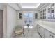 Breakfast nook with white cabinets, table, and chairs at 420 Beach Rd # 203, Sarasota, FL 34242
