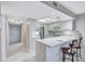 Kitchen with breakfast bar and tile floors at 420 Beach Rd # 203, Sarasota, FL 34242