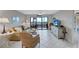 Coastal-themed living room with a balcony overlooking the ocean at 420 Beach Rd # 203, Sarasota, FL 34242
