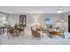 Living room featuring comfortable seating, dining area, and tiled flooring at 420 Beach Rd # 203, Sarasota, FL 34242