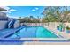 Close-up view of community pool and surrounding patio area at 420 Beach Rd # 203, Sarasota, FL 34242
