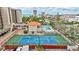 Community tennis court with a pool and clubhouse at 420 Beach Rd # 203, Sarasota, FL 34242