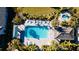 Aerial view of community pool with lounge chairs and a spa at 4326 Tamarind Pl, Bradenton, FL 34203