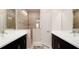 Spa-like bathroom with double sinks, a large walk-in shower and modern finishes at 4326 Tamarind Pl, Bradenton, FL 34203