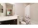 Clean bathroom with a shower/tub combo and dark vanity at 4326 Tamarind Pl, Bradenton, FL 34203