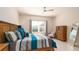 Main bedroom with king-size bed, dresser, and plenty of natural light at 4326 Tamarind Pl, Bradenton, FL 34203