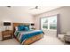 Spacious bedroom with large bed, wood furniture, and big window at 4326 Tamarind Pl, Bradenton, FL 34203