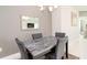 Elegant dining room with a marble table and four gray chairs at 4326 Tamarind Pl, Bradenton, FL 34203
