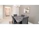 Bright dining area with a marble-top table and four chairs at 4326 Tamarind Pl, Bradenton, FL 34203