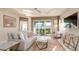 Bright living room with a comfy sofa and access to backyard patio at 4326 Tamarind Pl, Bradenton, FL 34203
