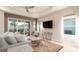 Comfortable living room with a large sofa and sliding glass doors at 4326 Tamarind Pl, Bradenton, FL 34203