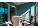 Bright screened-in porch with glass doors and seating area at 4326 Tamarind Pl, Bradenton, FL 34203