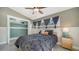 Cozy bedroom featuring neutral walls, a dark comforter, and ample natural light, creating a comfortable and inviting space at 4626 Gleason Ave, Sarasota, FL 34242