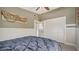 Neutral bedroom with dark comforter and large closet at 4626 Gleason Ave, Sarasota, FL 34242