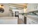 Modern kitchen with quartz countertops, stainless steel appliances, and white cabinetry at 4626 Gleason Ave, Sarasota, FL 34242