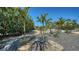 Professionally landscaped yard with gravel, stones and tropical plants, creating a serene outdoor space at 4626 Gleason Ave, Sarasota, FL 34242