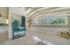 Bright living area with turquoise accents, seamlessly flowing into kitchen, perfect for entertaining at 4626 Gleason Ave, Sarasota, FL 34242