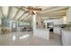 Open-concept living space featuring kitchen with modern appliances and living room with stylish decor at 4626 Gleason Ave, Sarasota, FL 34242