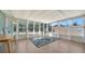 Bright sunroom featuring tile floors, large windows, and a beachy, relaxed atmosphere, perfect for enjoying the natural light at 4626 Gleason Ave, Sarasota, FL 34242