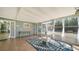 Bright sunroom featuring tile floors, large windows, and a beachy, relaxed atmosphere, perfect for enjoying the natural light at 4626 Gleason Ave, Sarasota, FL 34242