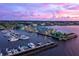 Aerial view of a marina at sunset at 490 Capri Isles Ct, Punta Gorda, FL 33950