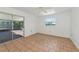 Bedroom with tile floors, sliding glass doors, and a ceiling fan at 4914 Silk Oak Dr, Sarasota, FL 34232