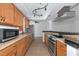 Bright kitchen with stainless steel appliances and wood cabinets at 4914 Silk Oak Dr, Sarasota, FL 34232