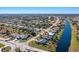 Aerial view of a residential neighborhood with a canal at 527 Rotonda Cir, Rotonda West, FL 33947