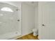 Bathroom with marble shower and white toilet at 527 Rotonda Cir, Rotonda West, FL 33947
