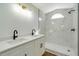 Modern bathroom with double vanity and marble shower at 527 Rotonda Cir, Rotonda West, FL 33947