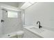 Bathroom with marble shower and single vanity at 527 Rotonda Cir, Rotonda West, FL 33947