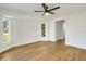 Bright bedroom with light wood floors and large windows at 527 Rotonda Cir, Rotonda West, FL 33947