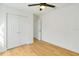 Bright bedroom with double door closet and light wood floors at 527 Rotonda Cir, Rotonda West, FL 33947