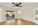 Spacious bedroom with light wood floors and sliding glass doors to a screened porch at 527 Rotonda Cir, Rotonda West, FL 33947