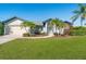 House exterior showcasing a well-manicured lawn at 527 Rotonda Cir, Rotonda West, FL 33947